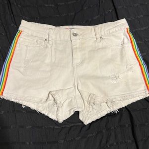 White jean shorts with rainbow stripes on side